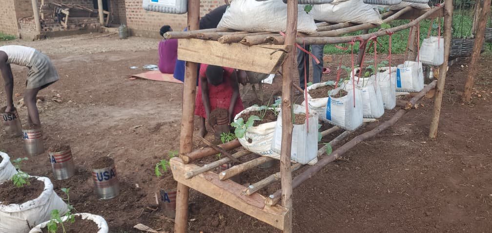 Packing of soil into sacks